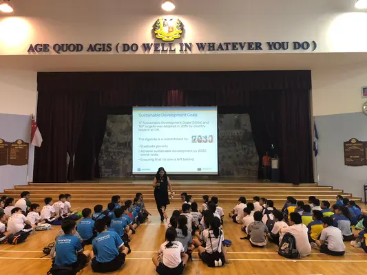Industry speaker presenting Sustainable Development Goals to students at school