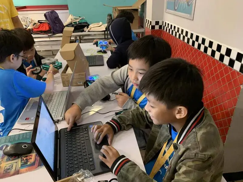 Kids collaborating on coding project at CodeFest
