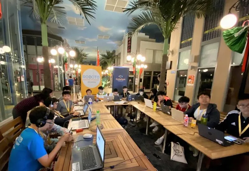 CodeFest participants working together on projects