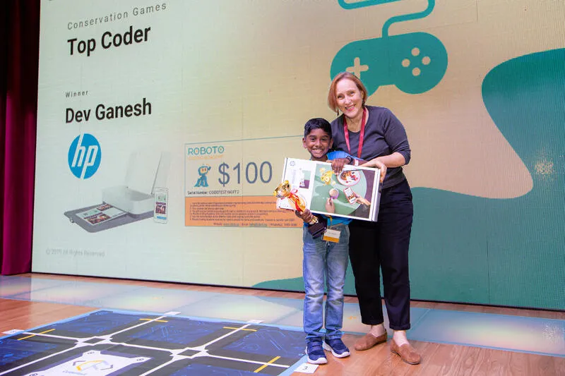 Top Coder winner receiving award at CodeFest ceremony