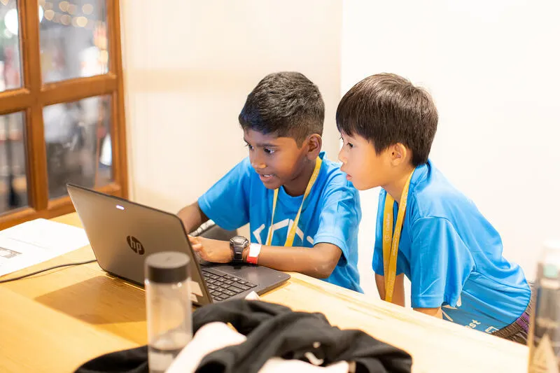 Two kids coding