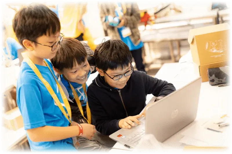 Kids coding together at CodeFest